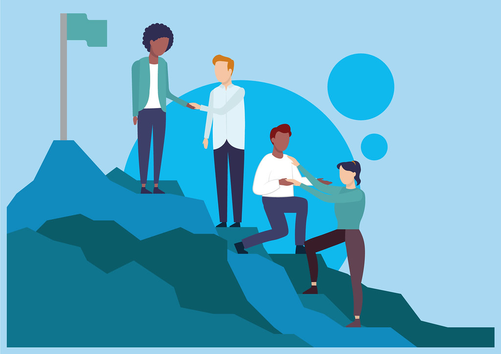 This is a picture of people helping each other to climb a hill, emphasizing leadership skills for project managers and one of the core skills for project success. Image from https://www.digits.co.uk/